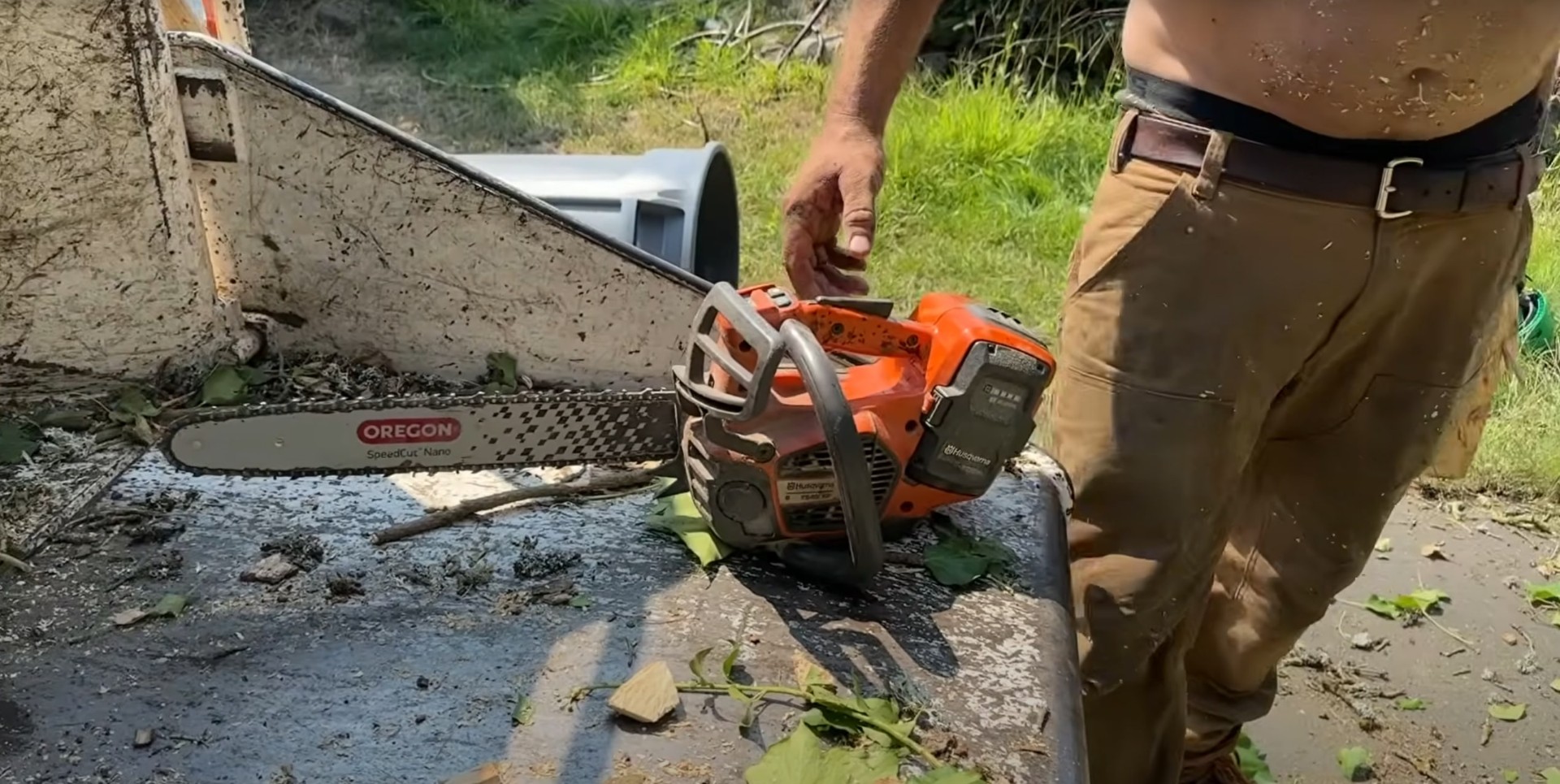 Professional chainsaw preparation for safe and efficient tree cutting Tree service professional preparing chainsaw equipment for tree cutting work